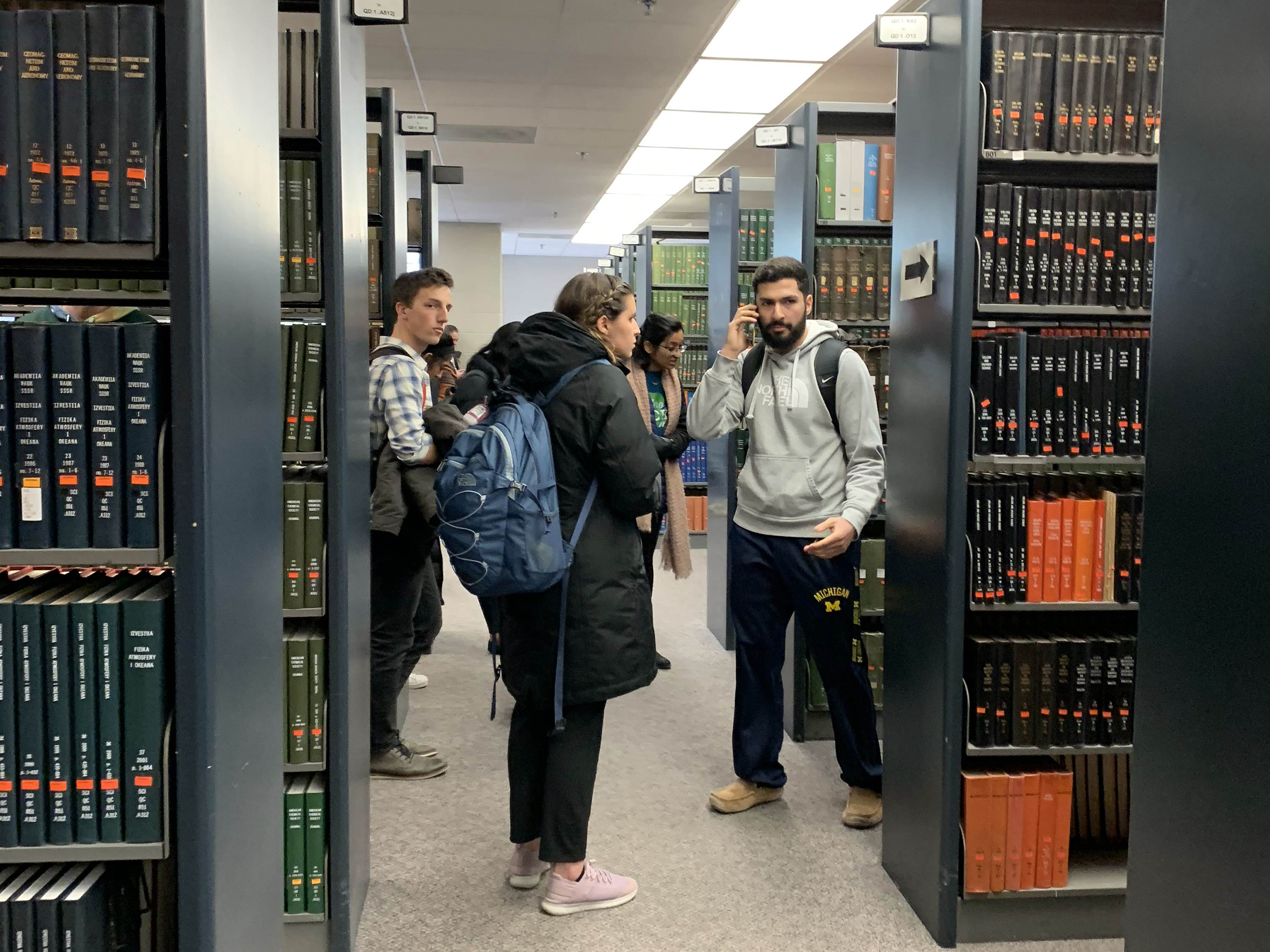 Students in a library during a false alarm .emergency
